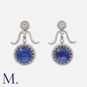 A Pair Of Tanzanite & Diamond Earrings in white gold, each comprising diamond set tops suspending