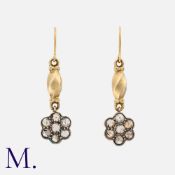 A Pair of Antique Rose Diamond Earrings in yellow gold and silver. Each set with seven rose cut