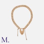 An Antique Rose Gold Curb Bracelet in 9K rose gold bracelet, secured with a heart padlock and safety