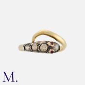 An Antique Diamond Snake Ring set with rose cut diamonds and two rubies to the eyes. Unmarked but