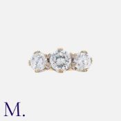 A Three Stone Ring in 9k yellow gold, set with three large round cut cubic zirconia. Stamped 375 for