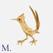 HAMMERMAN BROS. Road Runner Brooch in 18K yellow gold. Set with ruby to the eye and with articulated