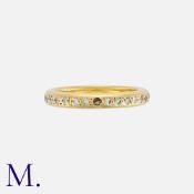 A Diamond Eternity Ring in yellow gold, Set throughout with round cut diamonds totalling