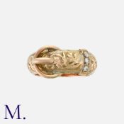 An Antique Buckle Ring in 9K yellow gold, set with three rose cut diamonds to the belt loop, with