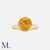A Yellow Sapphire Ring in 18k yellow gold, set with a round cut yellow sapphire of approximately 5.
