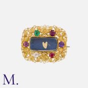 An Antique Regard Brooch set with ruby, emerald, garnet, amethyst and diamond to a gold filigree-