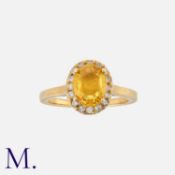A Yellow Sapphire and Diamond Ring