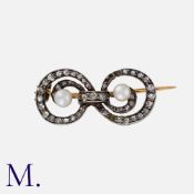 A Diamond and Pearl Brooch