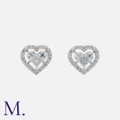 A Pair Of Diamond Earrings