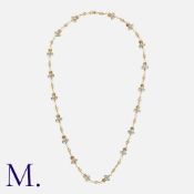 An Enamel And Diamond Chain Necklace in yellow gold, comprising a series of plique a jour enamel and