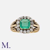An Antique Emerald and Diamond Ring in yellow gold, set with a cushion cut emerald (untested but