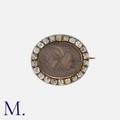 A Georgian Diamond Mourning Brooch from the early 19th Century in yellow gold and silver, set with