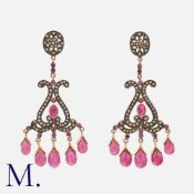 NO RESERVE. A Pair of Ruby and Diamond Earrings in silver and yellow gold, set with rose cut
