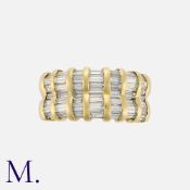 A Baguette Cut Diamond Ring in 18k yellow gold, set with baguette cut diamonds. Marked 18k, French