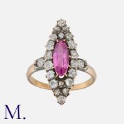 A Pink Sapphire And Diamond Navette Ring in yellow gold and silver, set with an elongated pink