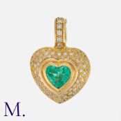 An Emerald and Diamond Heart Pendant in yellow gold, set with a heart-cut emerald (untested but in