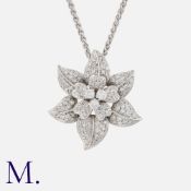A Diamond Flower Pendant and Chain in 18K white gold, the flower pendant set with round cut diamonds