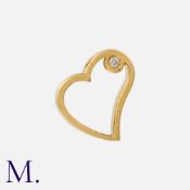 A Diamond Pendant in yellow gold, designed as a heart, set with a round cut diamond. Unmarked, tests