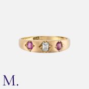 An Antique Ruby and Diamond Gypsy Ring in 18K yellow gold with an old cushion cut diamond to the