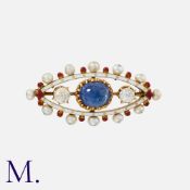 A Cabochon Sapphire, Diamond, Pearl And Enamel Brooch in yellow gold, the navette shaped brooch