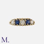 A Sapphire And Diamond Five Stone Ring in 15k yellow gold, set with alternating old cut diamonds and
