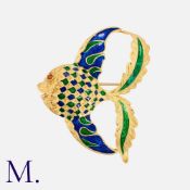 An Italian Enamel Fish Brooch in 18K yellow gold with decorative enamel in blue and green. Stamped