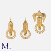An Etruscan Revival Brooch And Earrings Suite in yellow metal, comprising a pair of drop earrings