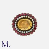 An Antique Citrine, Garnet And Pearl Brooch in yellow gold, comprising a large oval cut citrine