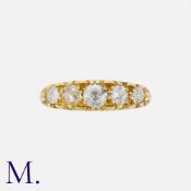 An Old Cut Diamond Five Stone Ring in 18k yellow gold, the carved half hoop set with five