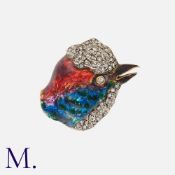 An Enamel And Diamond Bird Brooch in 18k yellow gold and silver, designed as the head of a bird,