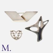 GEORG JENSEN. Three Silver Brooches, as follows: Brooch 1, an enamel and silver brooch, designed