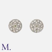 A Pair Of Diamond Cluster Earrings in 9k white gold, each set with a cluster of round cut