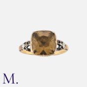 A Georgian Fluted Basket Smokey Quartz Ring in yellow gold, set with a cushion cut smokey quartz, in