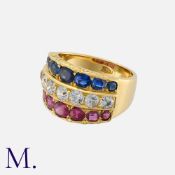 A Ruby, Sapphire And Diamond Ring in 18k yellow gold, comprising a row of sapphires, rubies and