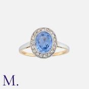 An Edwardian Sapphire And Diamond Cluster Ring in 18k yellow gold and platinum, set with a principal