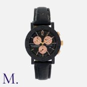BULGARI. A Limited Edition Carbongold Chronograph Wristwatch in carbon and 18K rose gold with