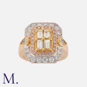A Diamond Ring in 18k rose gold set with four emerald cut diamonds within a border of round cut
