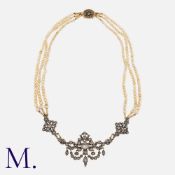 A Pearl And Diamond Collar Necklace in yellow gold and silver, comprising three strands of graduated