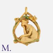 MASRIERA Y CARRERAS. A Nymph Pendant in 18K yellow gold in a nymph form and floral surround with