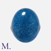 A Blue Stone and Diamond Ring in silver, set with a cabochon blue hardstone with diamond and blue