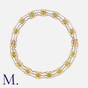 An Edwardian Peridot Necklace in 15 carat yellow gold and platinum, comprising fifteen octagonal