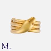 An Antique Snake Ring in 18K yellow gold, with coiled body and pleasant shaped face. Hallmarked