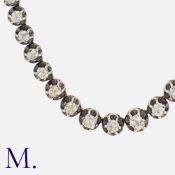 An Old Cut Diamond Rivière Necklace in yellow gold and silver, comprising seventy three old cut