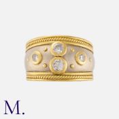 A Diamond Ring in 18K yellow and white gold, in the style of Elizabeth Gage, bezel set with four