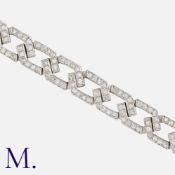 A Diamond Bracelet in platinum, comprising a series of interlocking curb links set with round cut