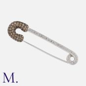 ADLER, A Diamond Safety Pin Brooch in 18 carat white gold, designed as a safety pin, set with