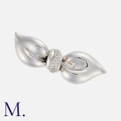 ASPREY. A Diamond Bow Brooch in 18K white gold, in a fine, stylised bow design set with round cut