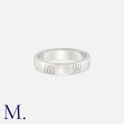 CARTIER. A 'Happy Birthday' Logo Band in platinum. Signed Cartier and serial numbered. Marked