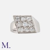 A Diamond Ring in platinum, the lozenge shaped form set with nine old cut diamonds totalling