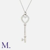 TIFFANY & Co. A Small Heart Key Pendant Necklace, Signed T&Co, 925. Size: Pendant: 3.2cm Chain: 42cm